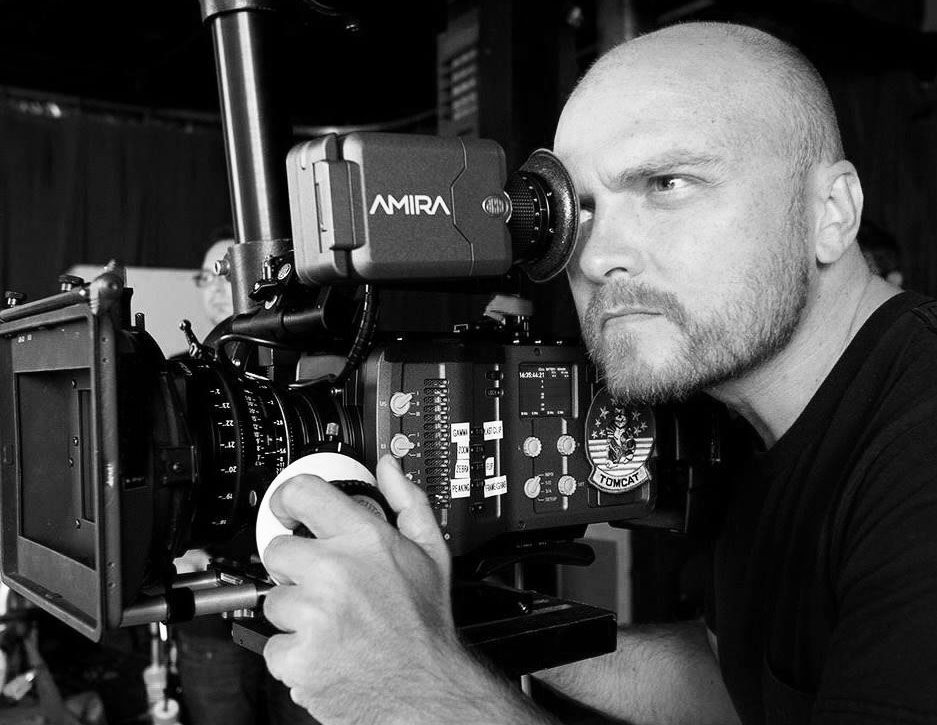 Director Michal Siewierski operating a cinema camera